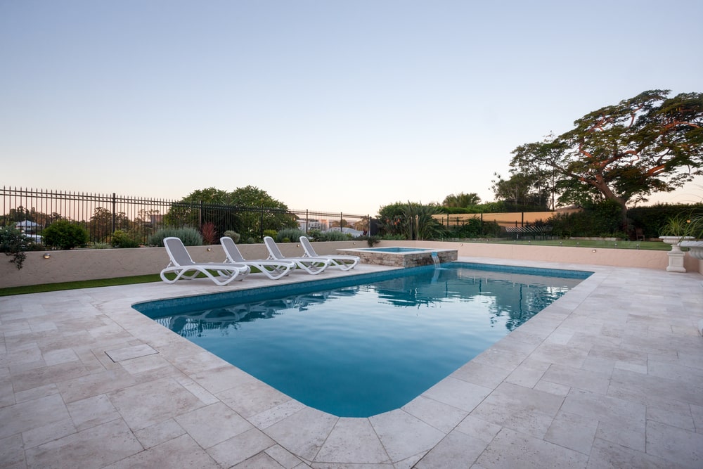 Swimming Pool with Fence Around It